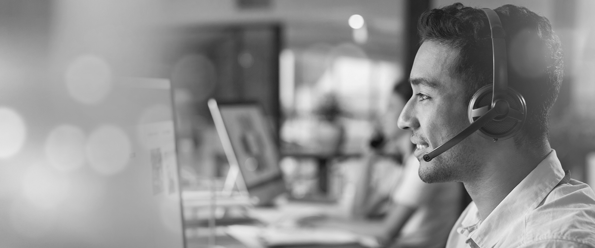 Customer support team member sitting at desk